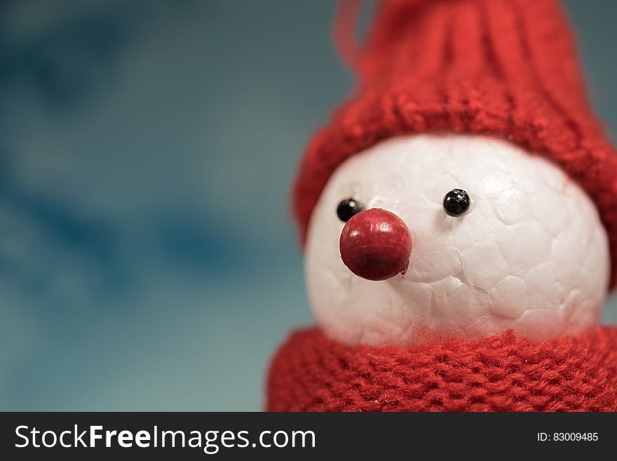 A styrofoam snowman with red cap, scarf and nose. A styrofoam snowman with red cap, scarf and nose.