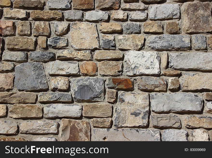 Gray Brown and Black Brick Stone Wall