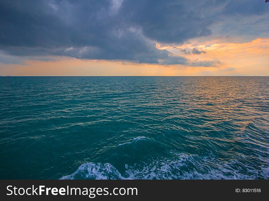 Sunset over ocean waves