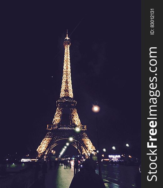 Eiffel Tower in Paris, France illuminated at night. Eiffel Tower in Paris, France illuminated at night.