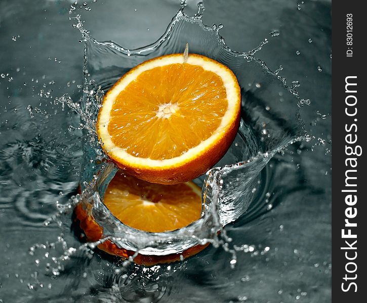 Time Lapse Photography of Orange Fruit on Water