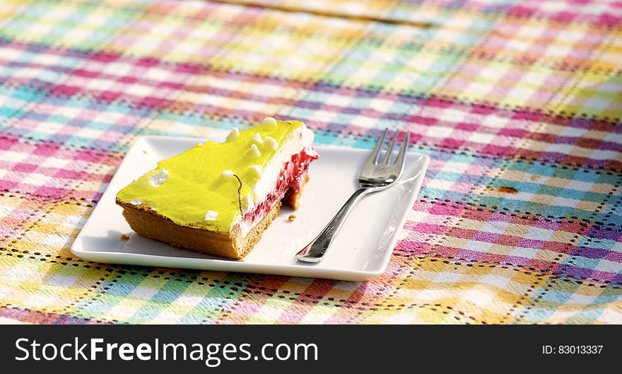 Yellow and Brown Pastry on White Saucer