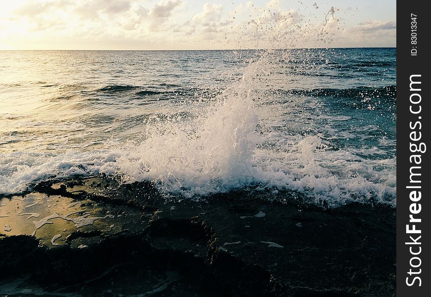 Scenic view of waves breaking on beach.