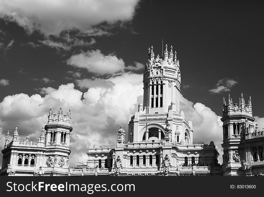 Facade of palace against cloudy skies in black and white. Facade of palace against cloudy skies in black and white.