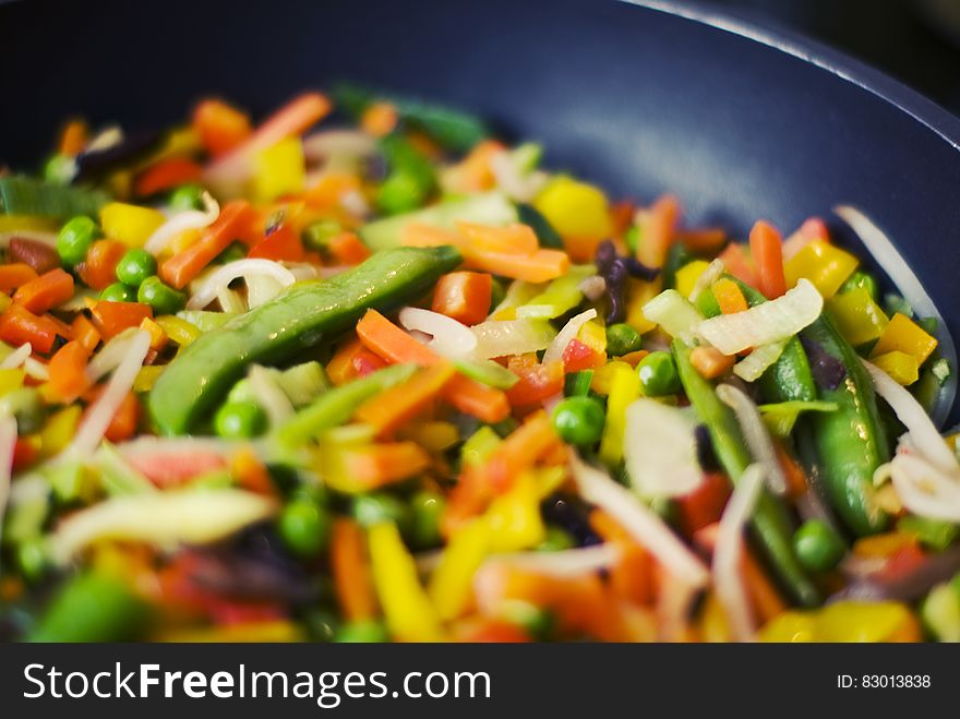 Close up of mixed diced vegetables in pan. Close up of mixed diced vegetables in pan.