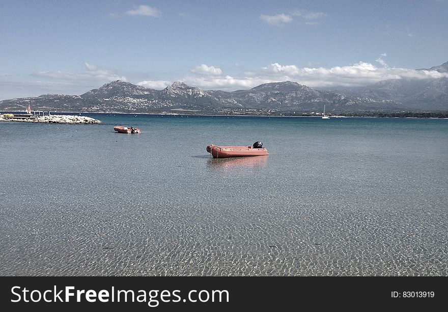 Inflatable raft boats on waters of alpine like on sunny day.