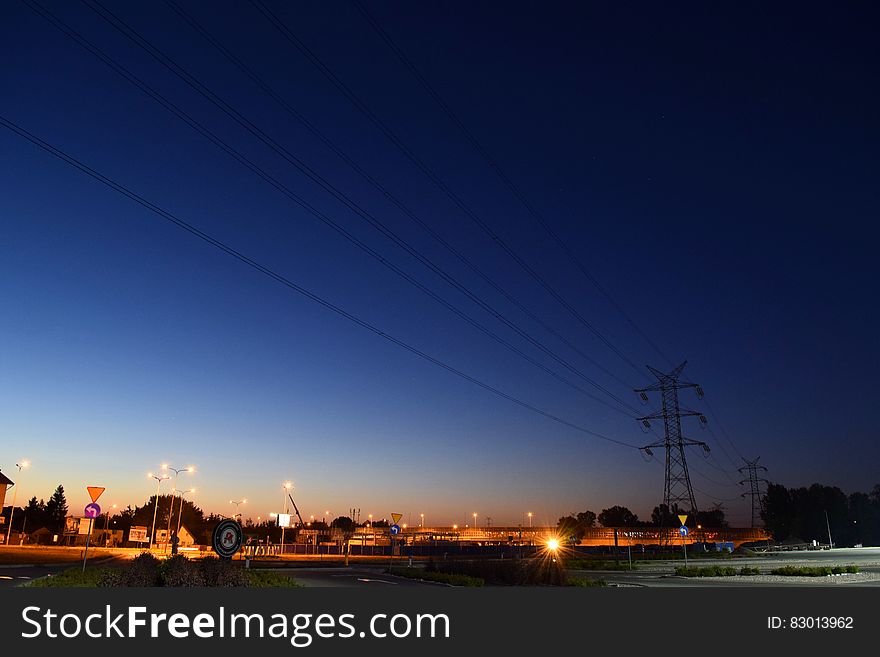 Power Lines On Night Roadside