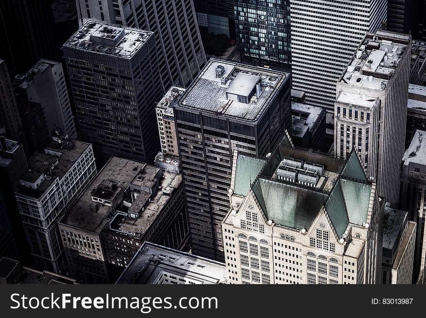 Aerial view over modern city rooftops. Aerial view over modern city rooftops.