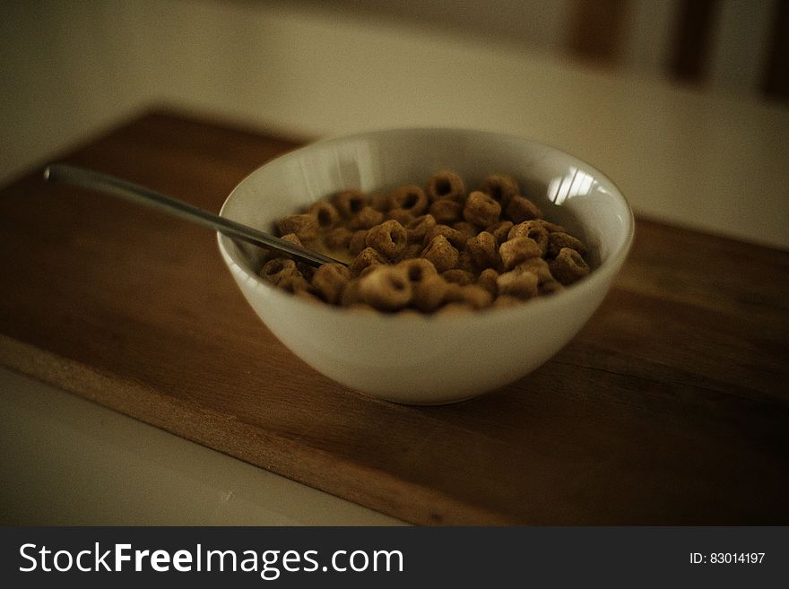 Cereal on White Ceramic Bowl With Spoon