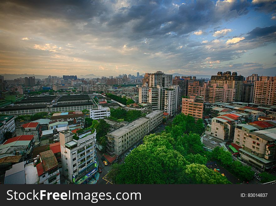 White Concrete City Buildings Under White Blue Sky At Daytime