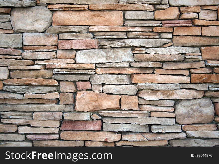 Wall with multi-coloured stones. Wall with multi-coloured stones.