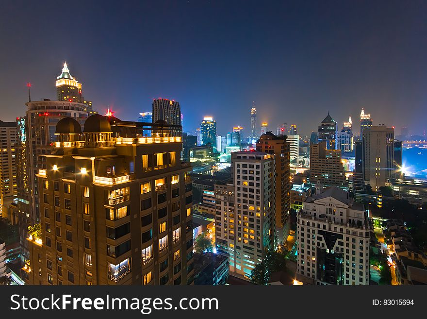 Urban skyline illuminated at night. Urban skyline illuminated at night.