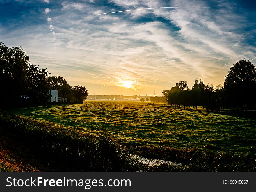 Sunset Over Rural Meadow