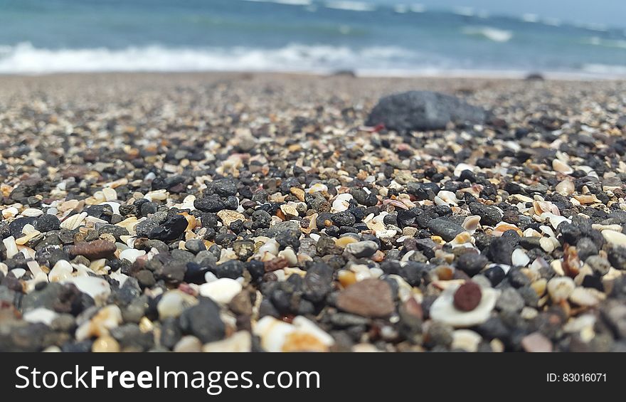Close up of pebbles on beach.