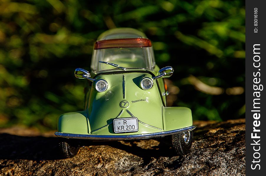 Green and Gray Miniature Car Toy