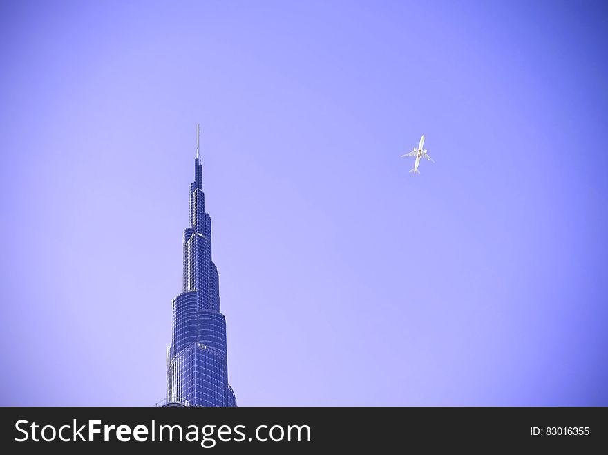 A plane on the sky over the Burj Khalifa in Dubai.