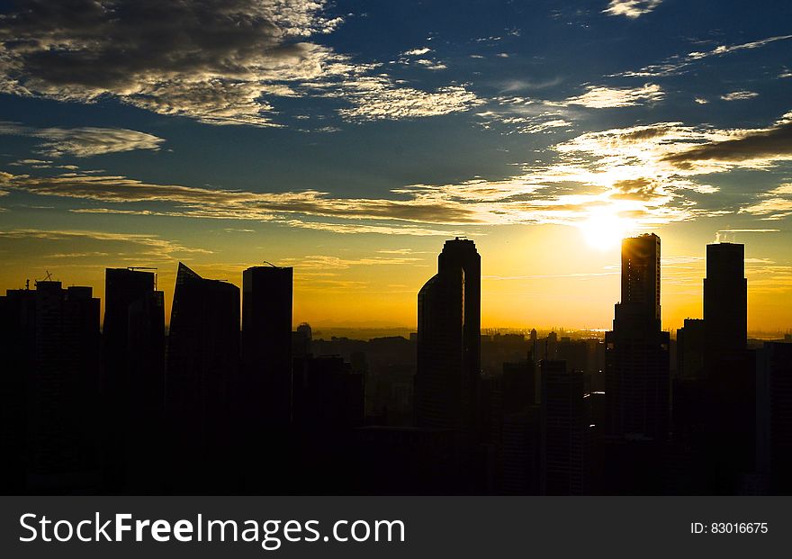 Silhouette Photo of City Building during Sunset