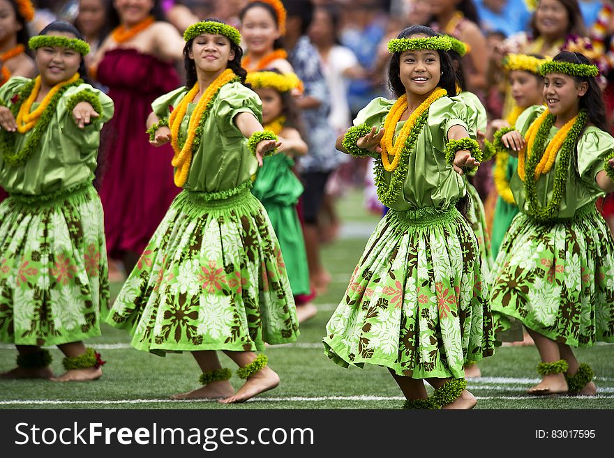 Girl&x27;s In Green Dress Dancing During Daytime With Leis