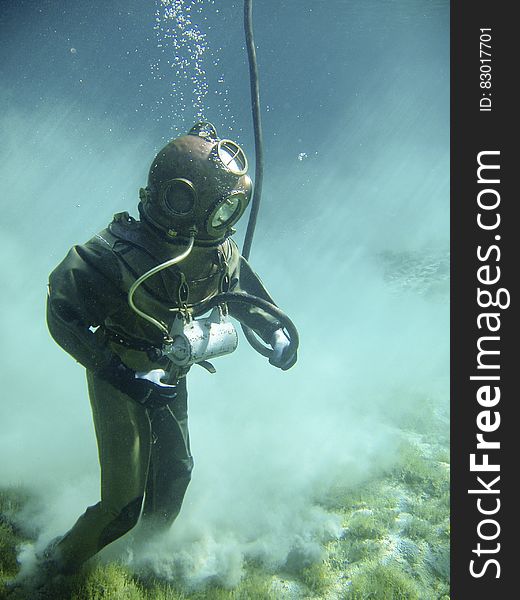 Person in Green Scuba Diving Suit