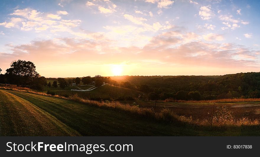 Sunset over rural hillside