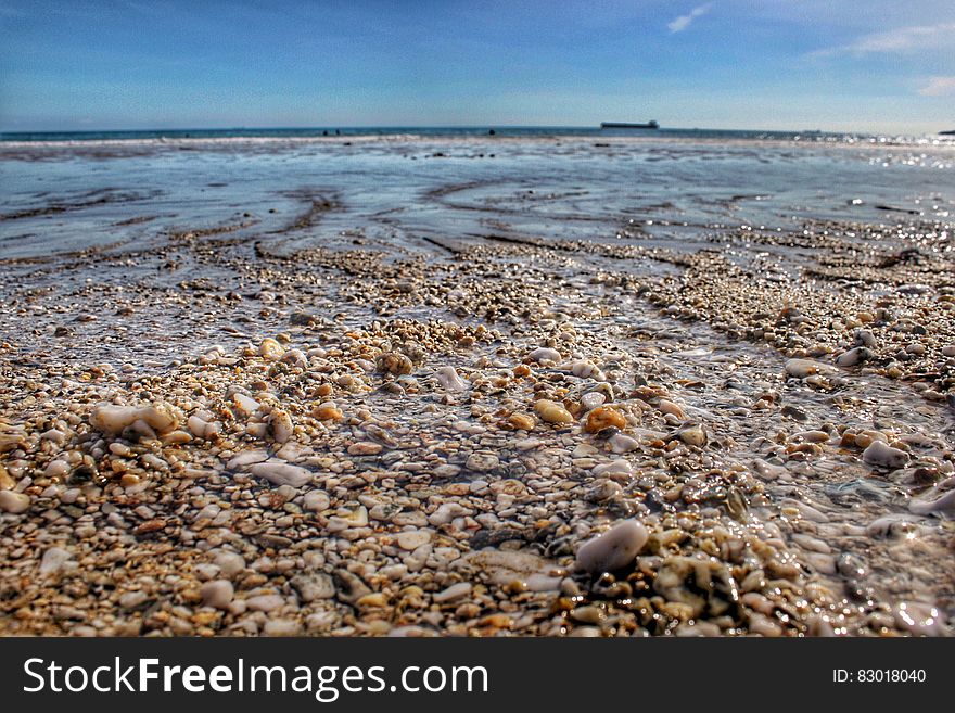 Stones By The Seashore During Day