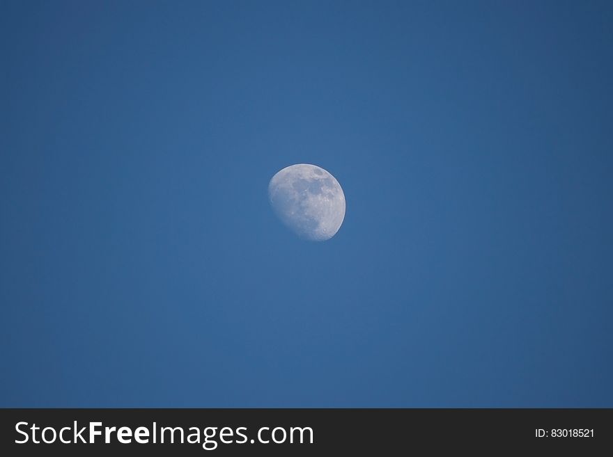 Full moon in blue skies at twilight. Full moon in blue skies at twilight.