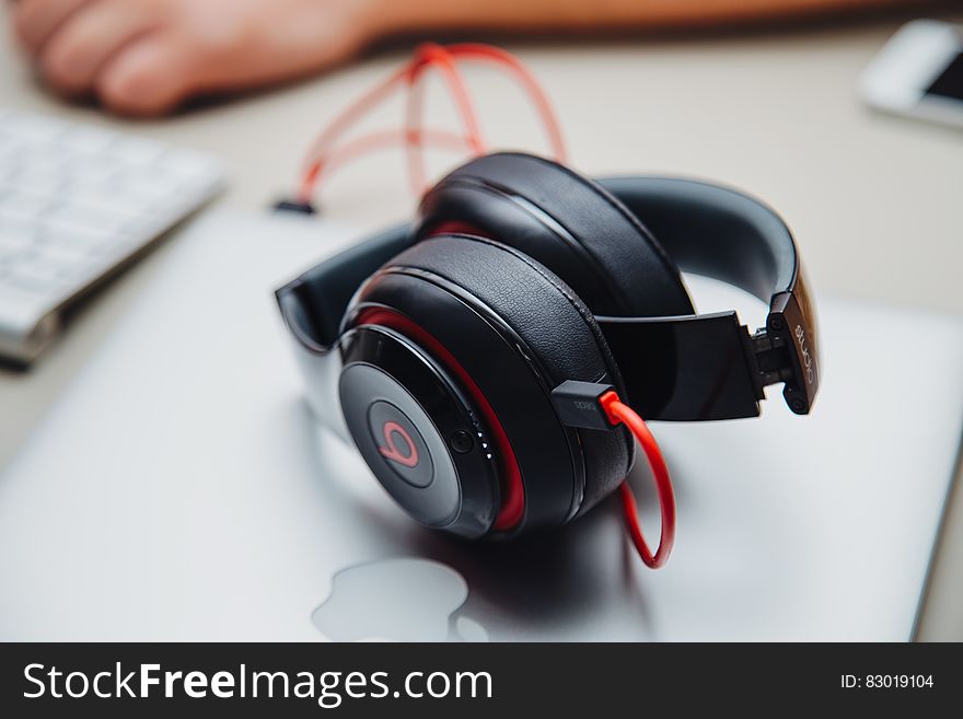 Close up of Beat headphones on Apple laptop.