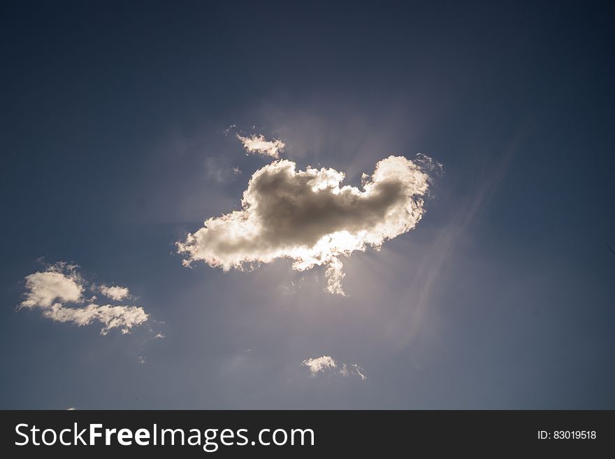 Sun behind a cloud with a silver lining. Sun behind a cloud with a silver lining.
