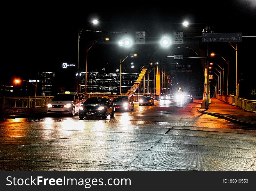 Cars moving along a bridge at night. Cars moving along a bridge at night.