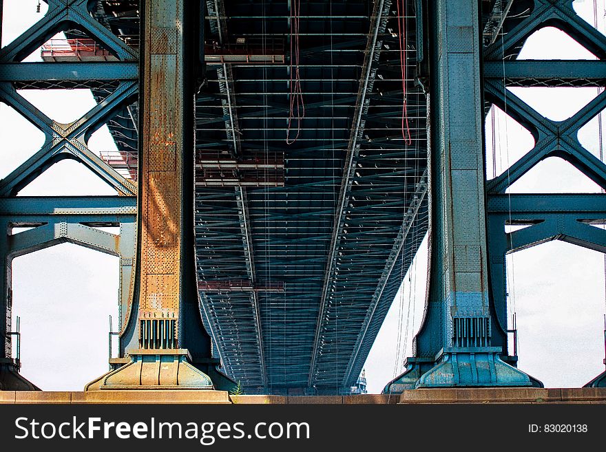 Blue Metal Bridge in Low Angle Photo at Daytime