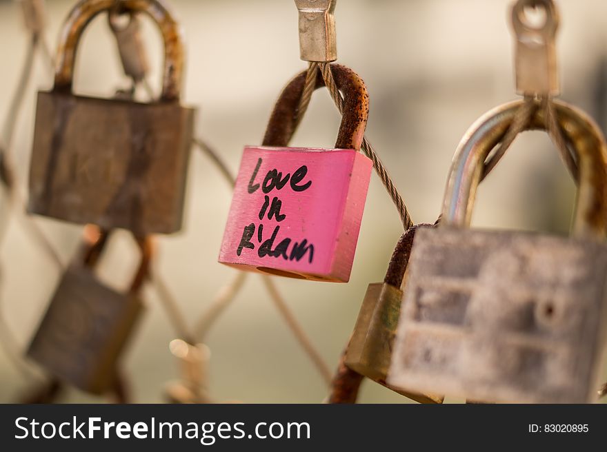 Close up of pink padlock on Rotterdam, Netherlands locks of love fence. Close up of pink padlock on Rotterdam, Netherlands locks of love fence.