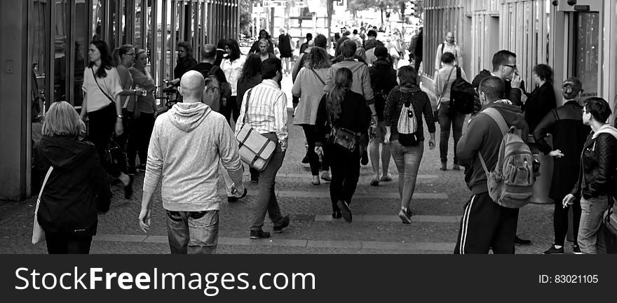 Panorama of pedestrians on city walkway in black and white. Panorama of pedestrians on city walkway in black and white.