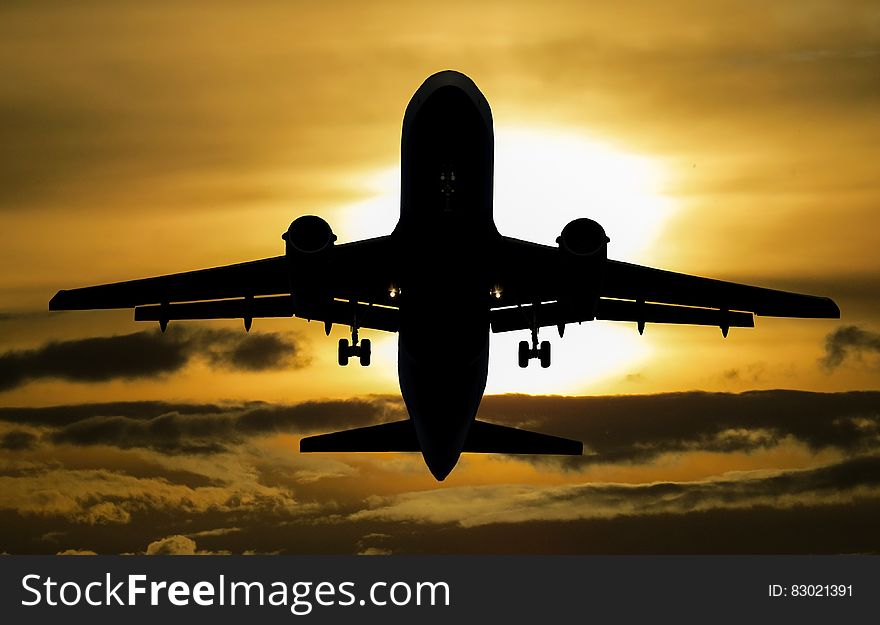 Silhouette of Airplane during Sunset