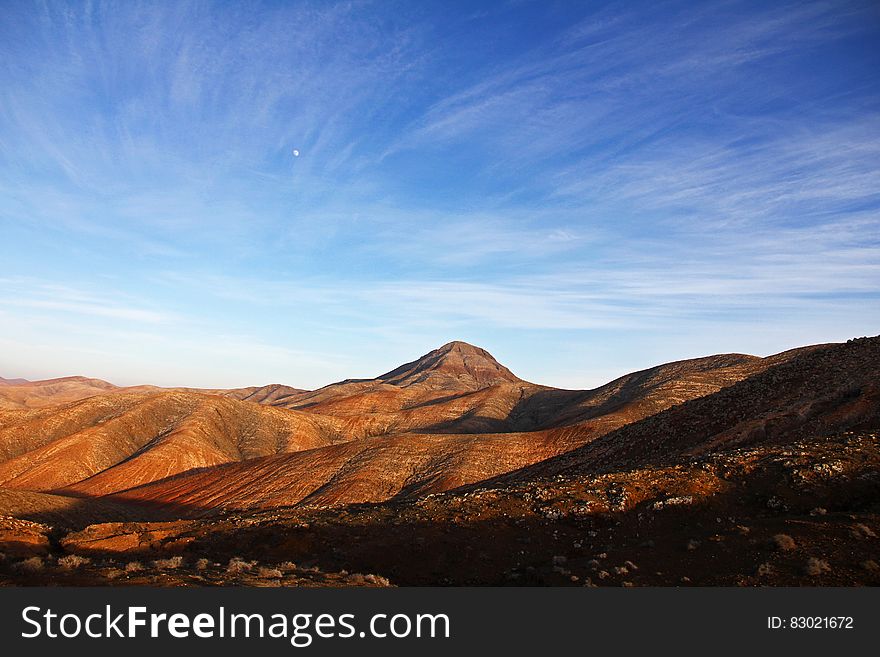 Blue Sky Under Brown Mountain