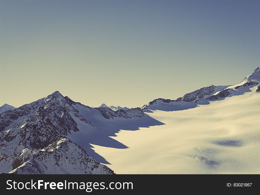 Scenic View of Snow Covered Mountains Against Sky