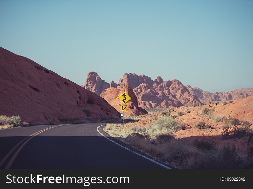 Winding empty country road in Australia desert on sunny day. Winding empty country road in Australia desert on sunny day.