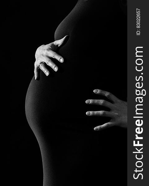 Gray Scale Photo of a Pregnant Woman