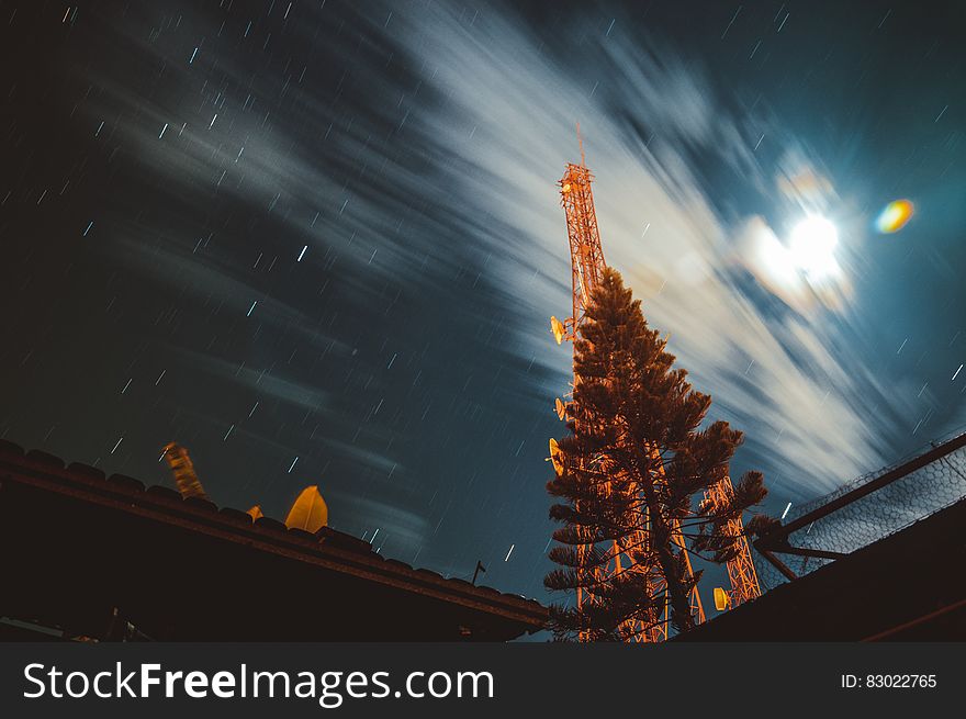 Long exposure of night sky with clouds and star trails. Long exposure of night sky with clouds and star trails.