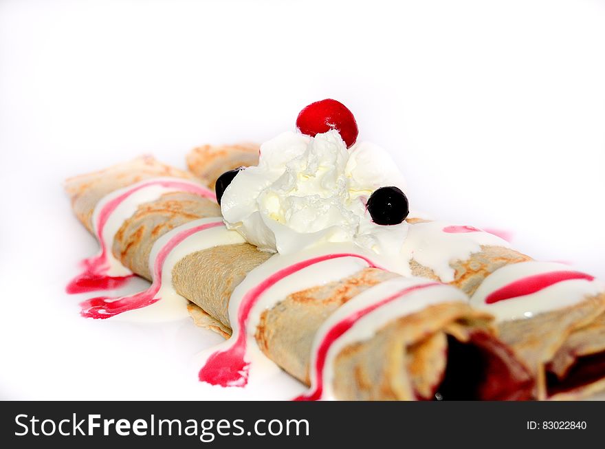 Cherry And Whipped Cream Topped Crepe