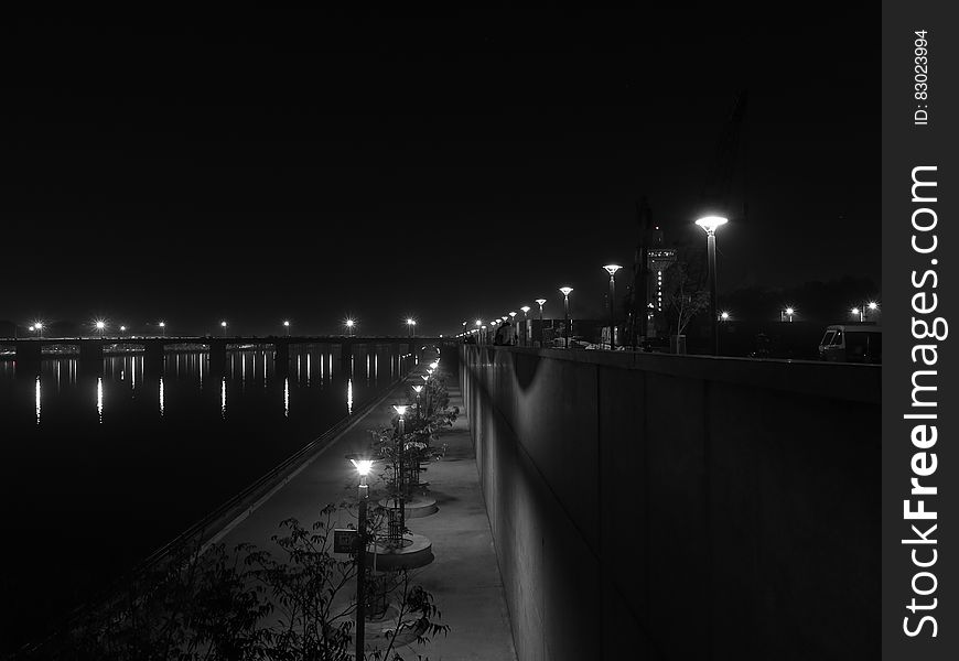 Lights Turned on during Nighttime in Grayscale Photography