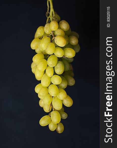 Cluster of green grapes on black background. Cluster of green grapes on black background.