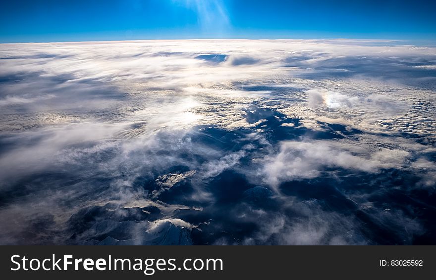 Aerial view of cloudscape over blue sea. Aerial view of cloudscape over blue sea.
