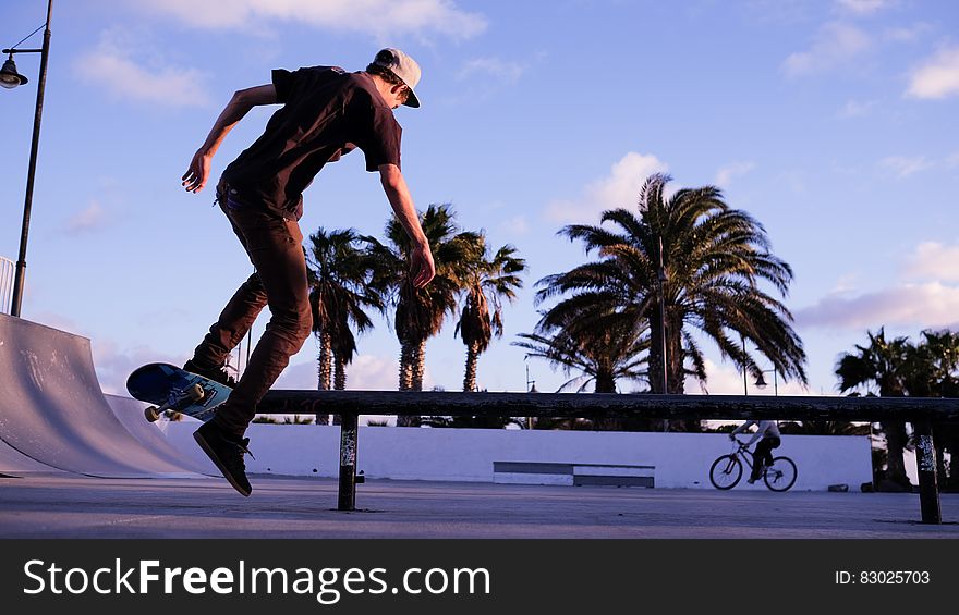 Man Playing Skateboard during Daytime