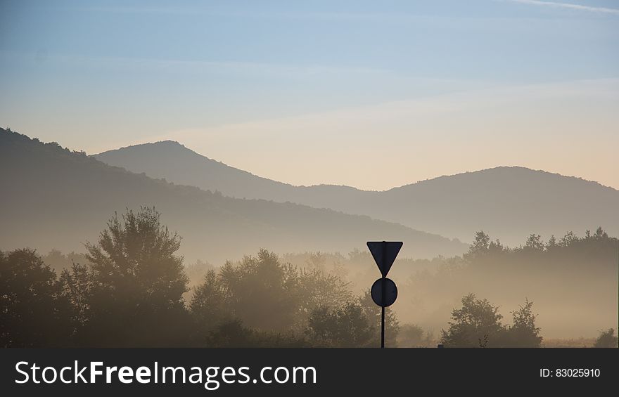 Fog over mountain valley at sunset. Fog over mountain valley at sunset.