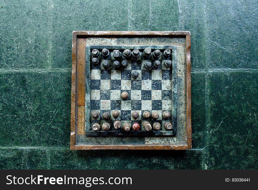 A vintage chessboard on stone.