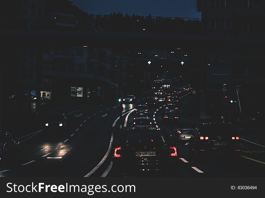 Cars On Roadway At Night