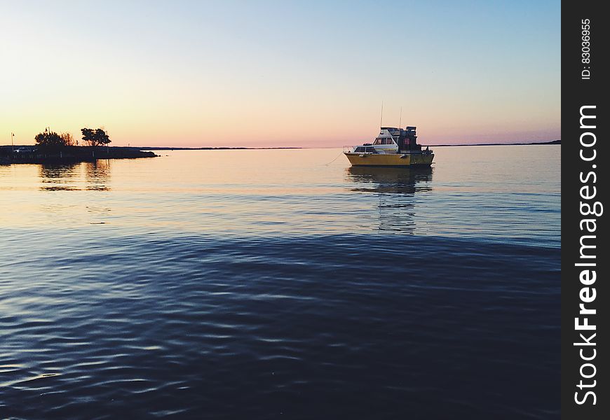 A boat at the sea at dusk. A boat at the sea at dusk.