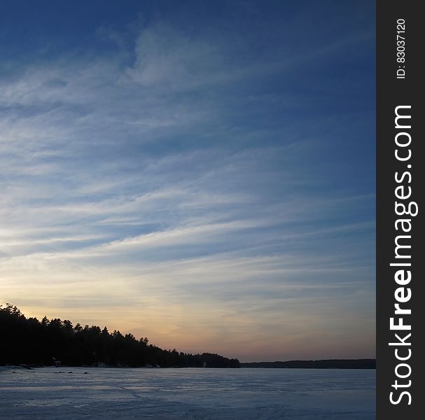 A blue sky over a frozen lake. A blue sky over a frozen lake.