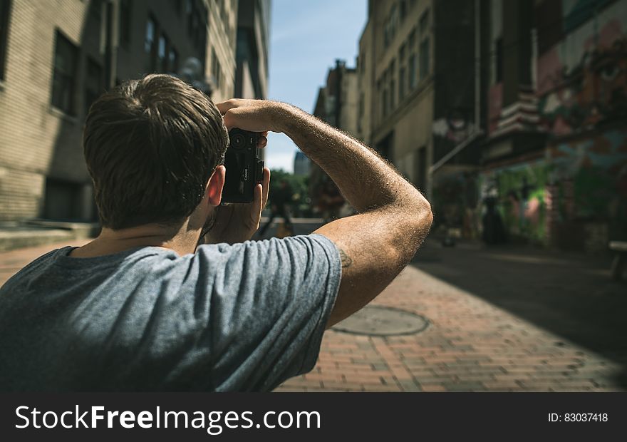 Young Man Looking Down The Street