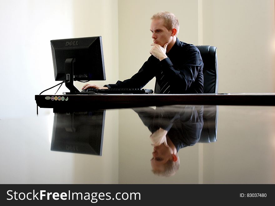 Man Sitting Facing Pc Inside Room